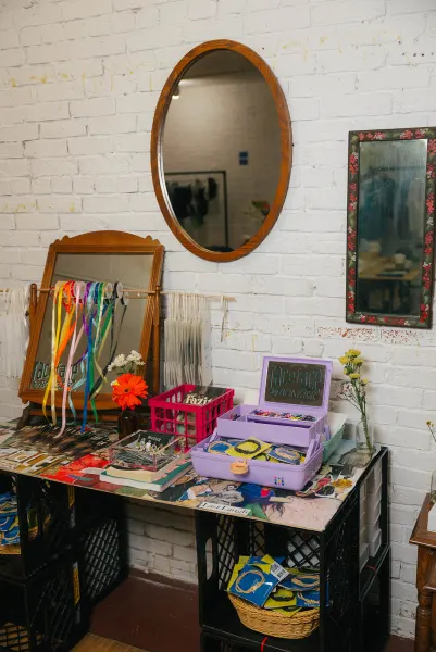 The Face Face by Bonzer station: two mirrors, ribbons, and a lilac caboodle full of face paint